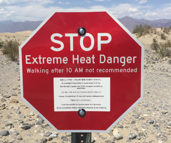 Street Sign - Stop, Extreme Heat Danger Walking after 10 AM is not recommended.